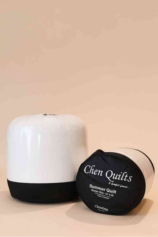 Chen Quilts summer duvet in bag with folded white quilted bedding