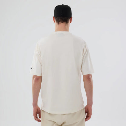 The model is wearing this MLB Food Graphic LA Dodgers Oversized T-Shirt in open white. 2