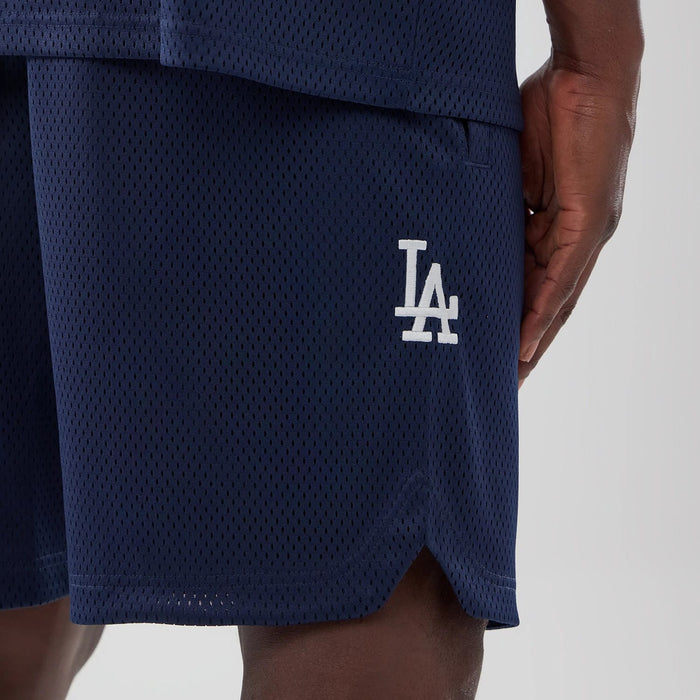 The model is wearing this MLB Mix League LA Dodgers Oversized Mesh Shorts in blue. 4