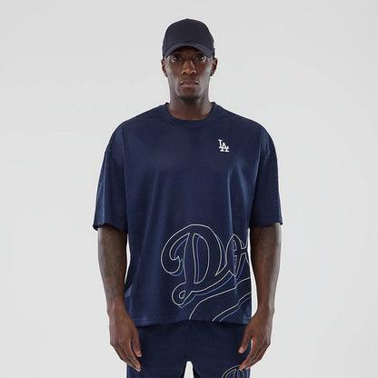 The model is wearing this MLB Mix League LA Dodgers Oversized Mesh T-Shirt in blue. 1