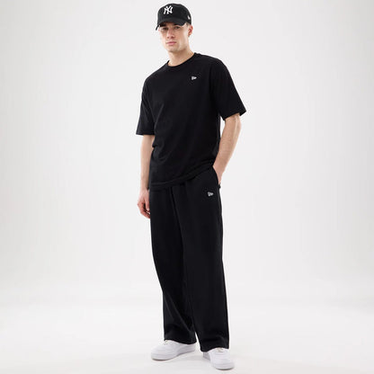 The model is wearing this New Era Straight Legged Joggers in black. 7