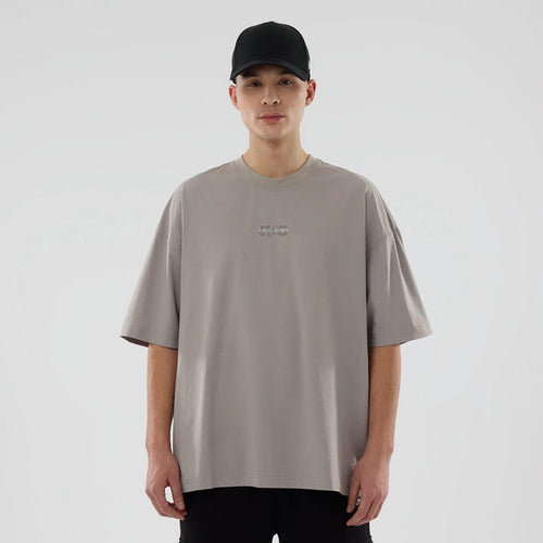 The model is wearing this New Era NEC Logo Oversized T-Shirt in Beige. 1