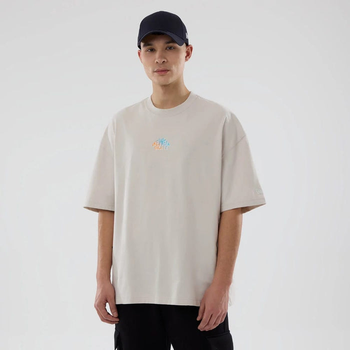 The model is wearing this New Era Skate Is Life Graphic Oversized T-Shirt in Cream. 7