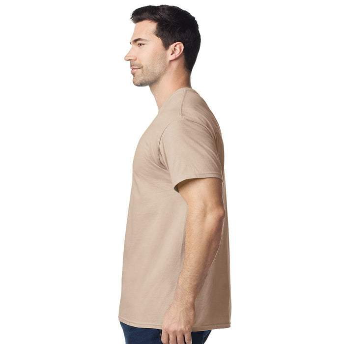 model wearing mens gildan short sleeve heavy cotton tshirt side view sand