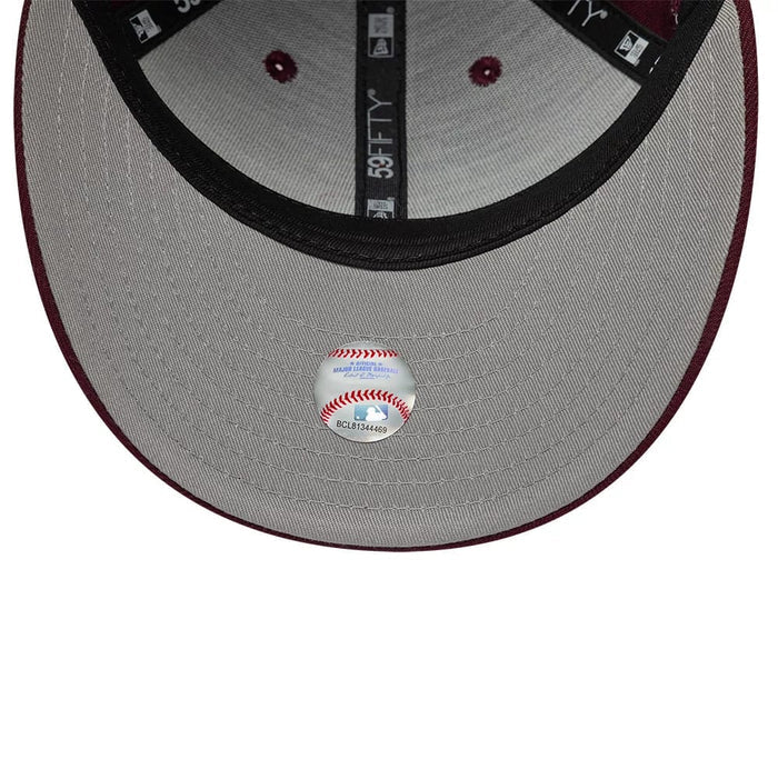 Pictured is this MLB College Varsity St. Louis Cardinals Low Profile 59FIFTY Fitted cap in dark red. 2